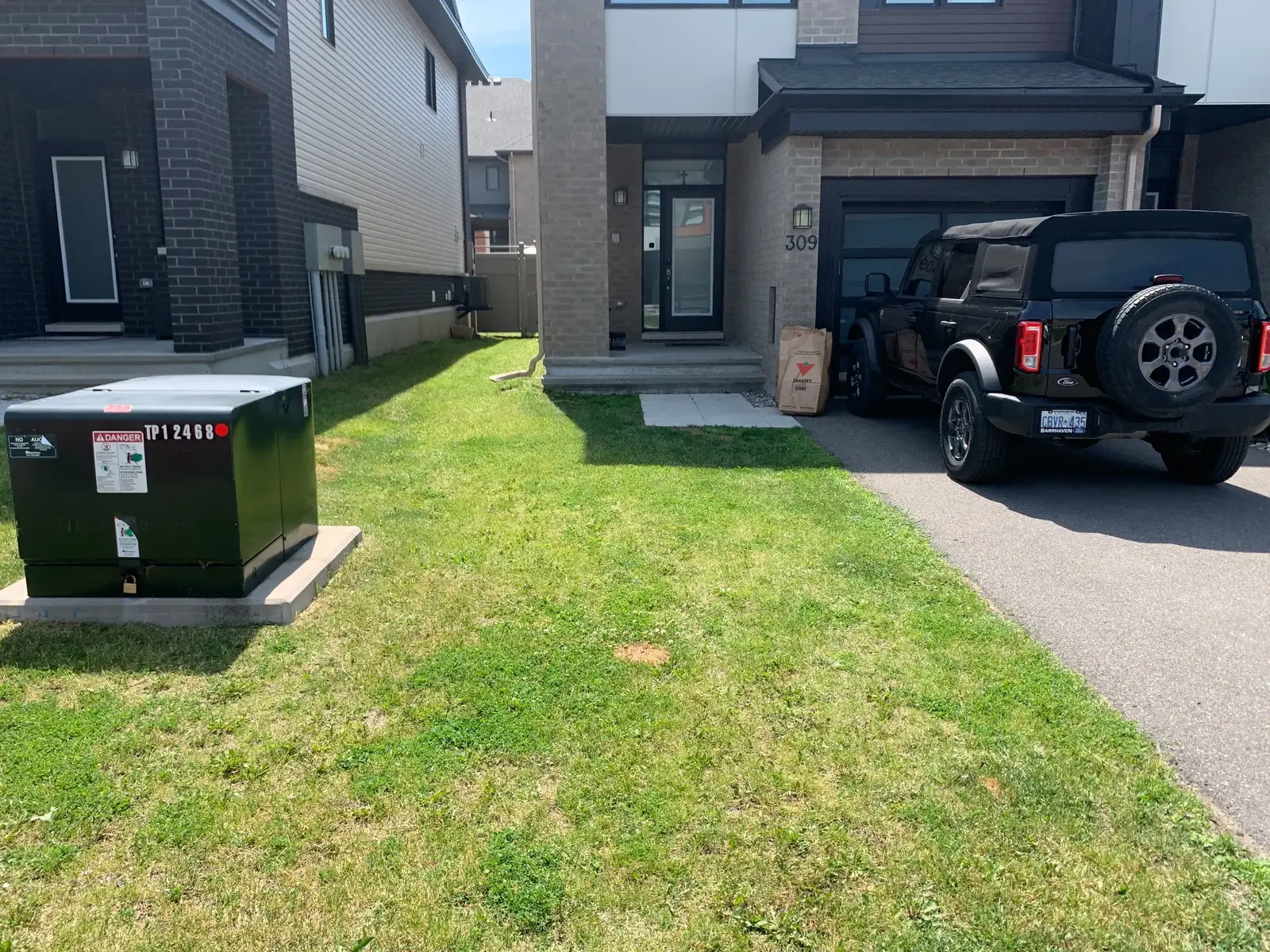 Thin compacted townhouse lawn ready for an Ottawa recovery plan